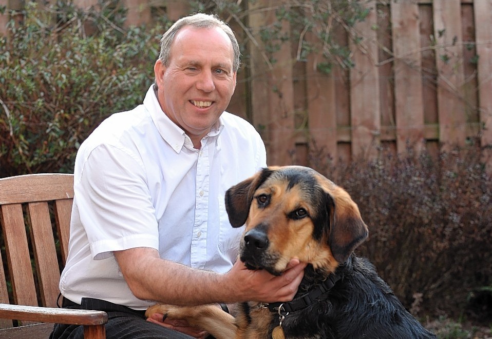Aberdeenshire West MSP Dennis Robertson with his guide dog Mr Q.